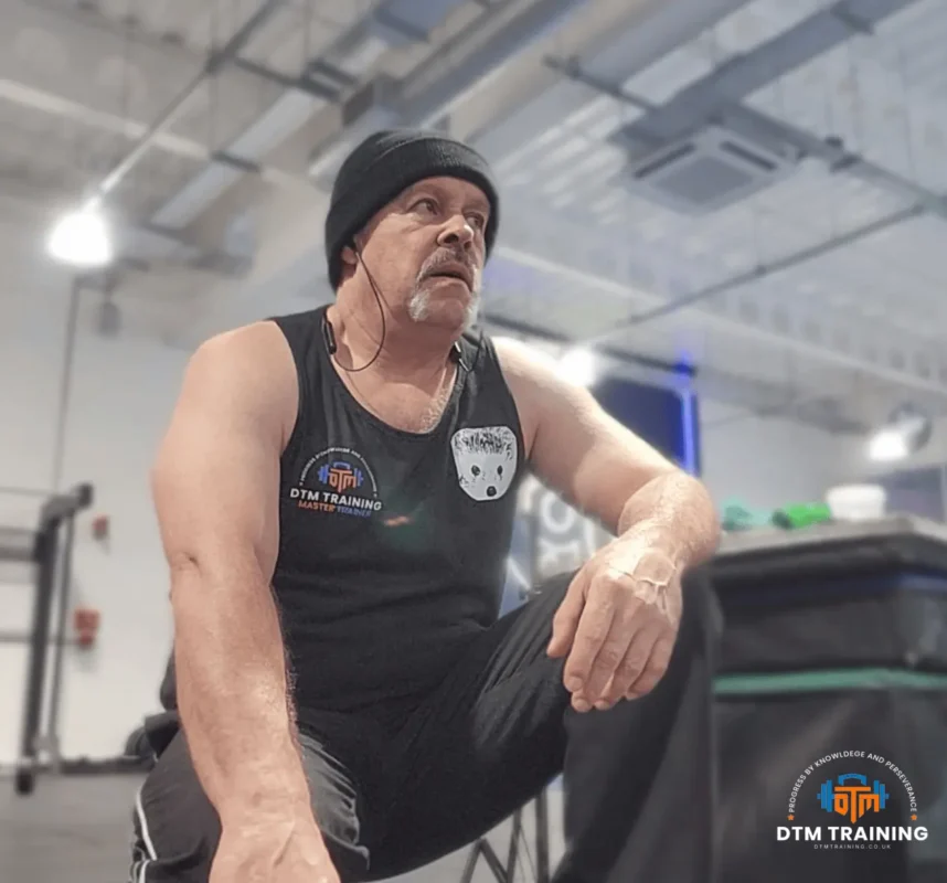 Daniel Batir resting between conditioning exercises during a gym training session, demonstrating a disciplined approach to fitness and physical preparation.
